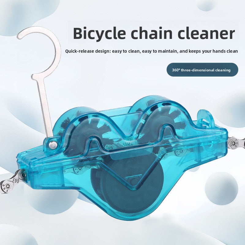 Luxivor translucent blue bike chain cleaning tool clamped on a bicycle chain